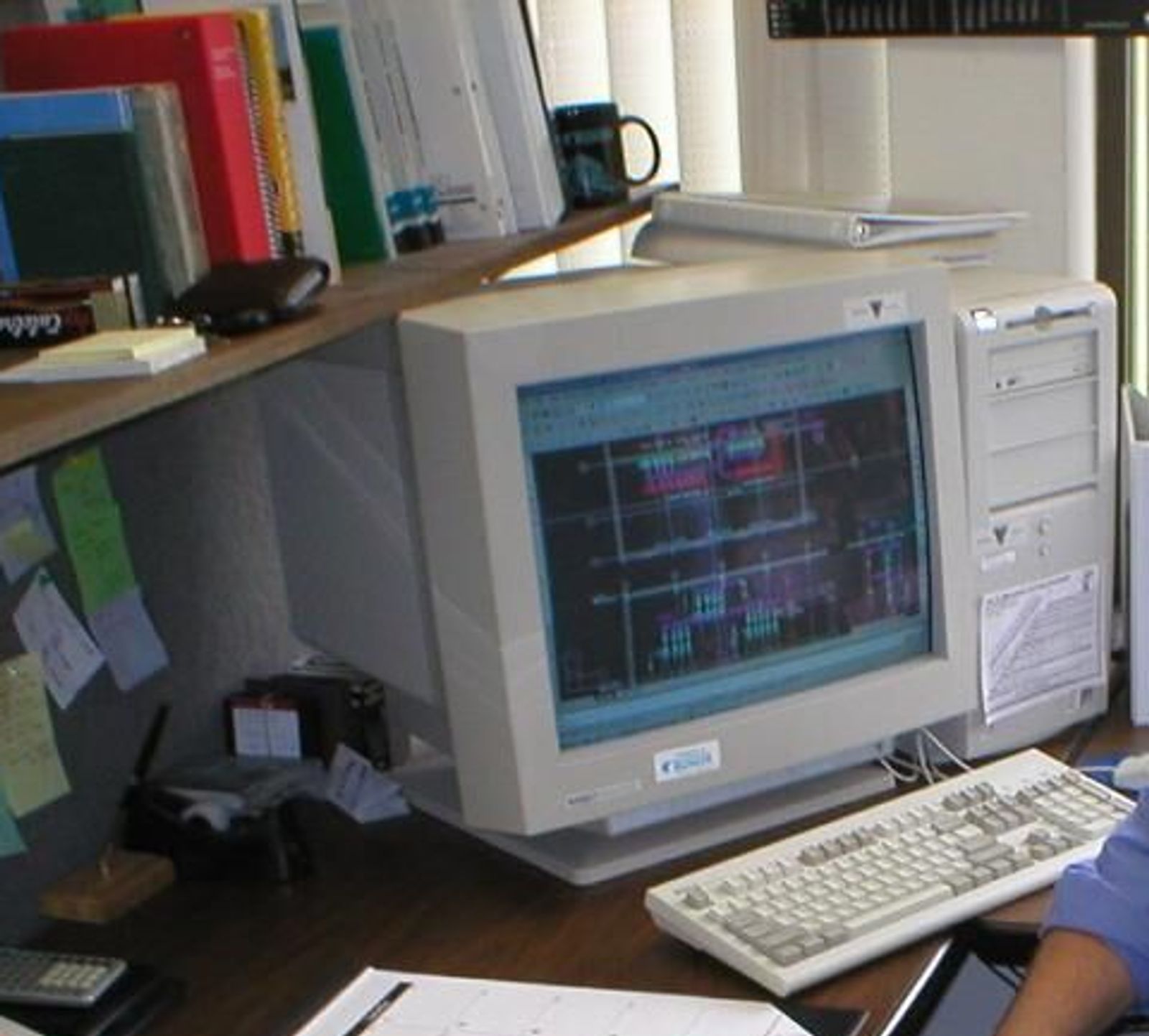Mark Shervey in the office with an old computer.